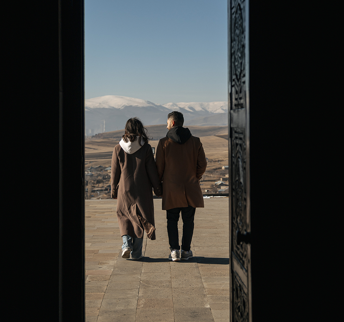 Tigran and Karina walking through doorway